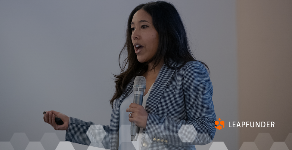 Young African American woman speaking at a conference